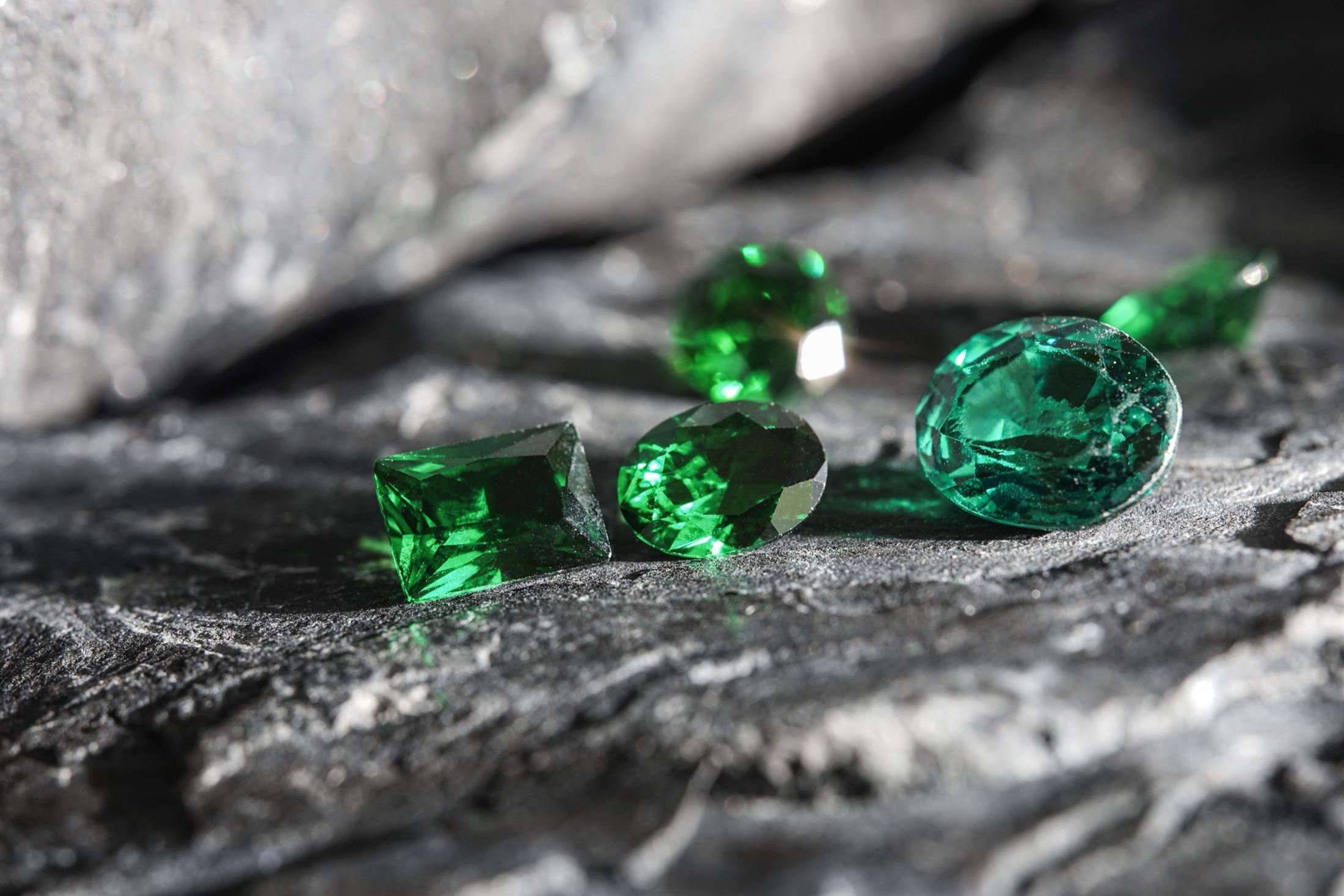 Rough natural green gemstones before cutting and selection